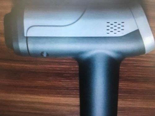 Customer photo review of 20 Speed LCD Display Muscle Massager Gun With 6 Massage Heads - More Colors
