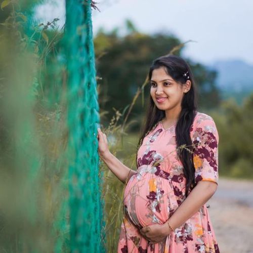 Customer photo review of Luxe Peach Rouge Maternity Flow Dress