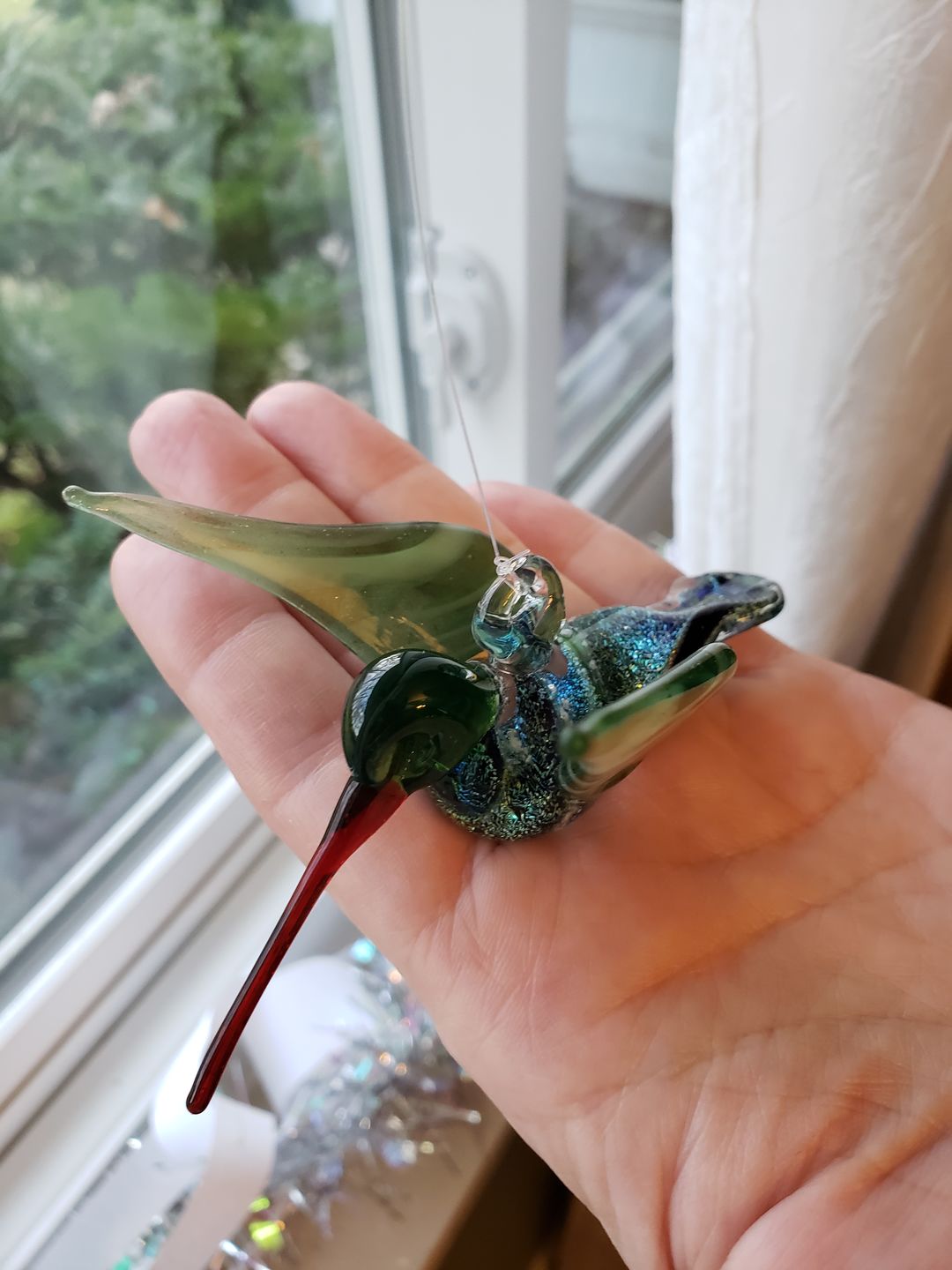 Customer photo review of Dichroic Twist Glass Hummingbird with Infused Ash