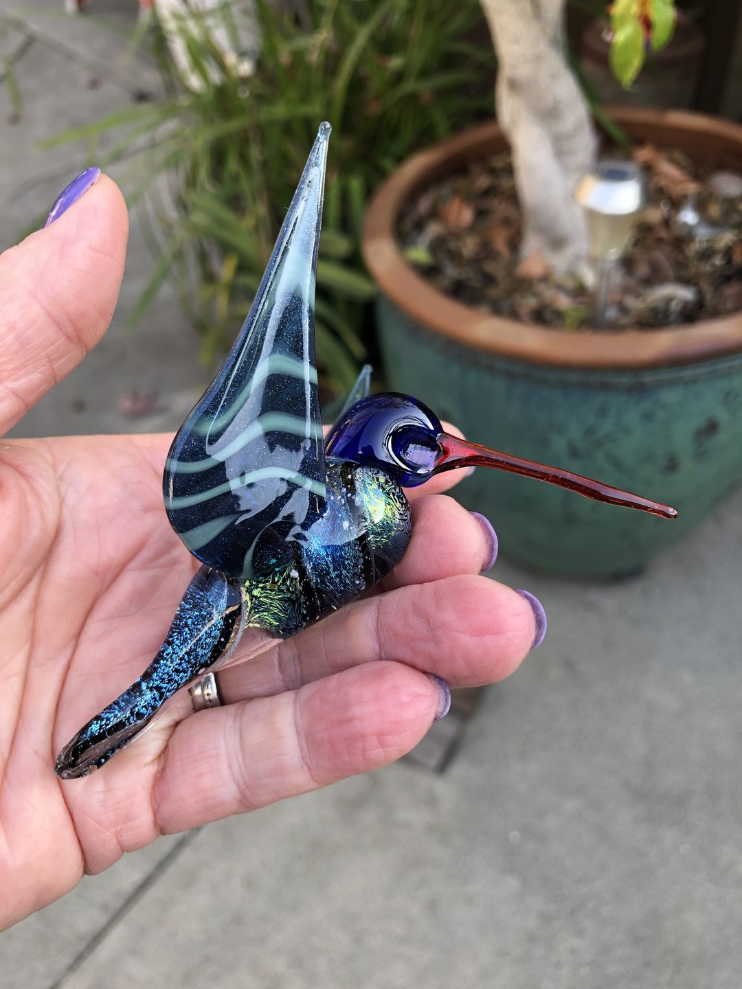 Customer photo review of Dichroic Twist Glass Hummingbird with Infused Ash