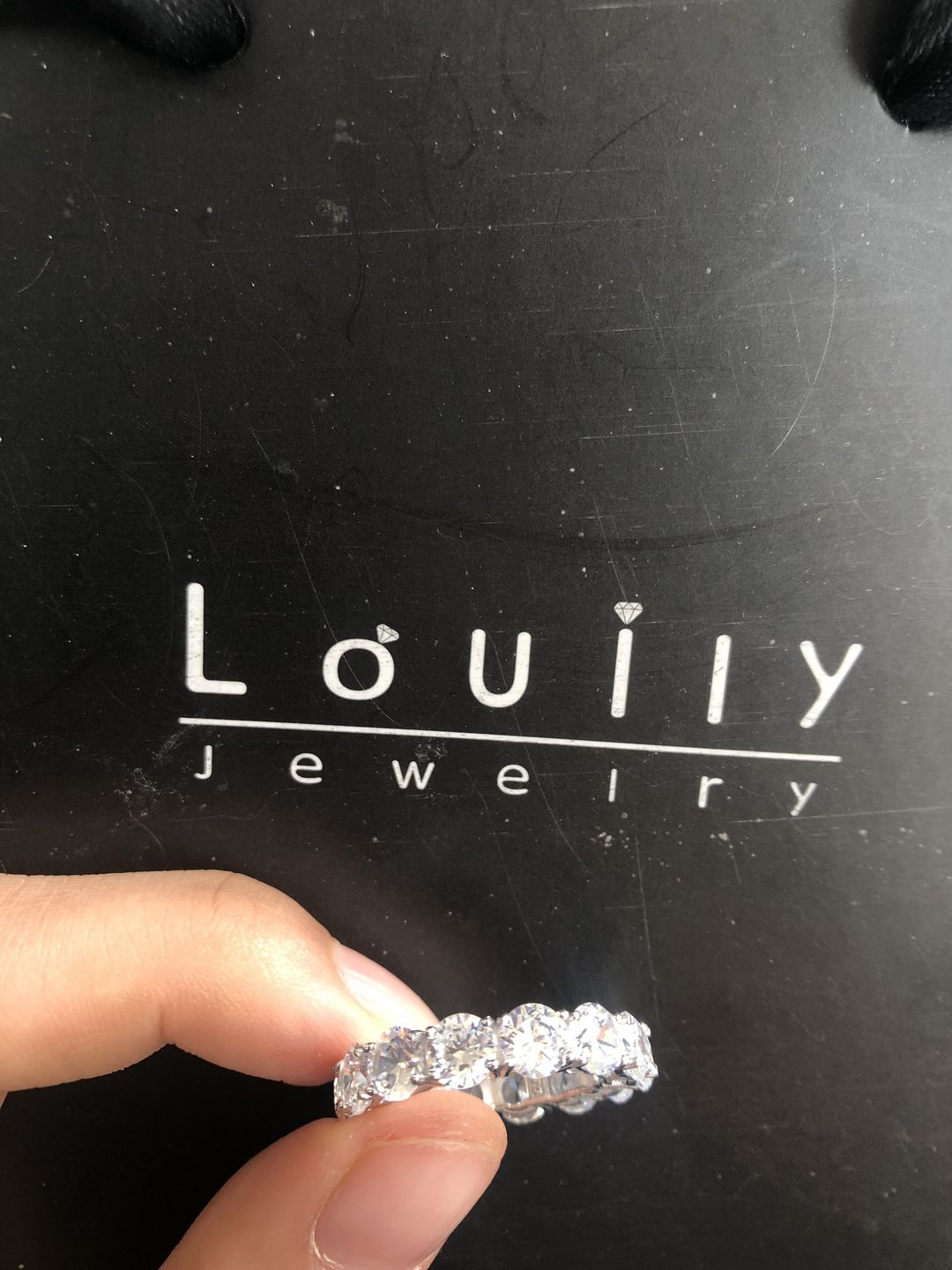 Customer photo review of Louily Classic Eternity Round Cut Women's Wedding Band In Sterling Silver