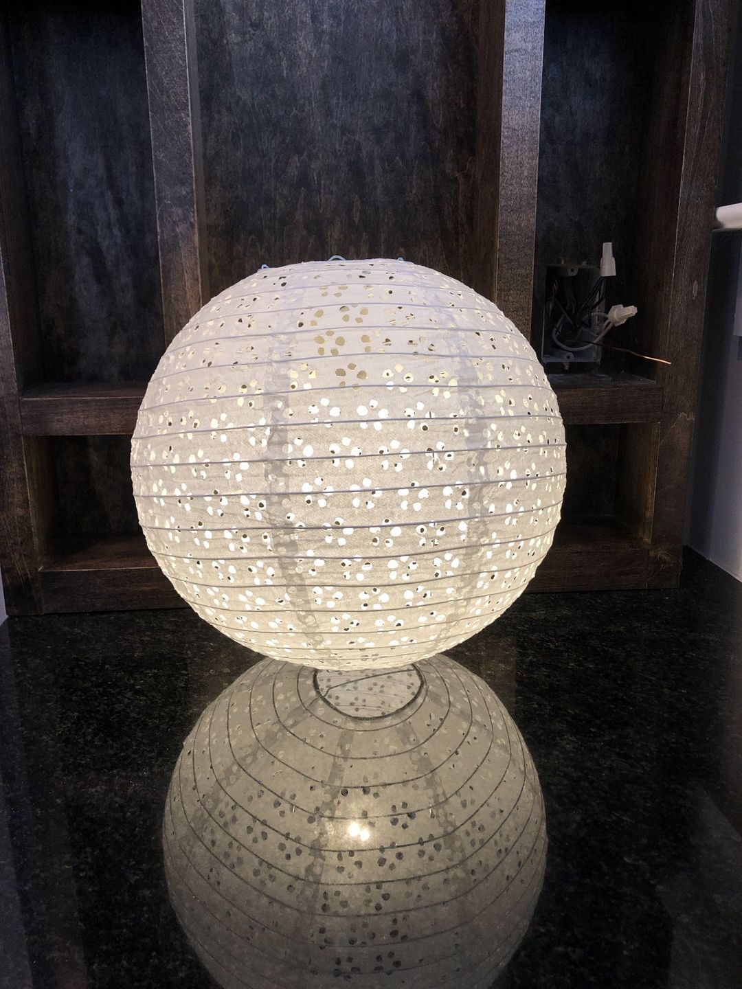 Customer photo review of 12" Round Eyelet Lace Look Paper Lantern - White