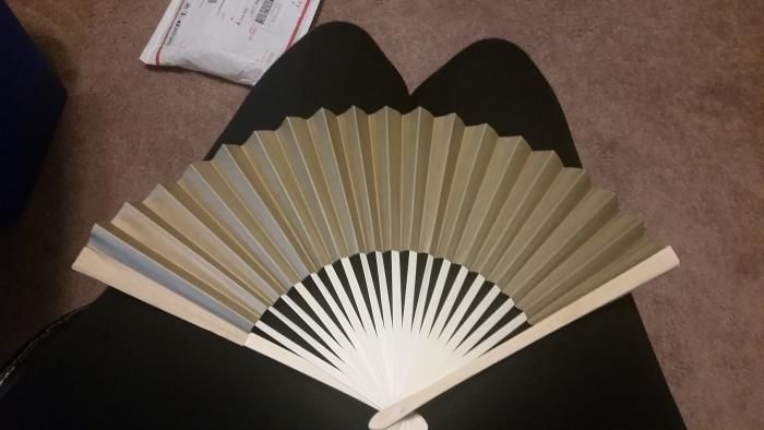 Customer photo review of 9" Gold Paper Hand Fans for Weddings, Premium Paper Stock (10 Pack)