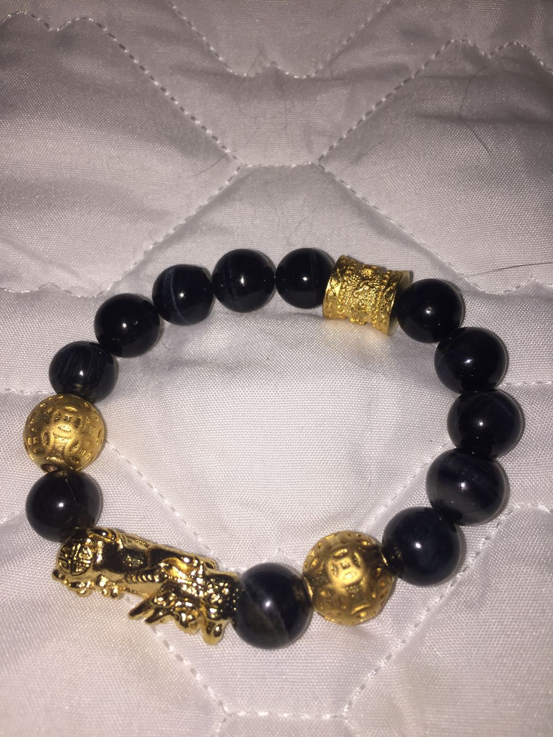 Customer photo review of Blue Tiger Eyes Wealth Mantra Feng Shui Pixiu Bracelet