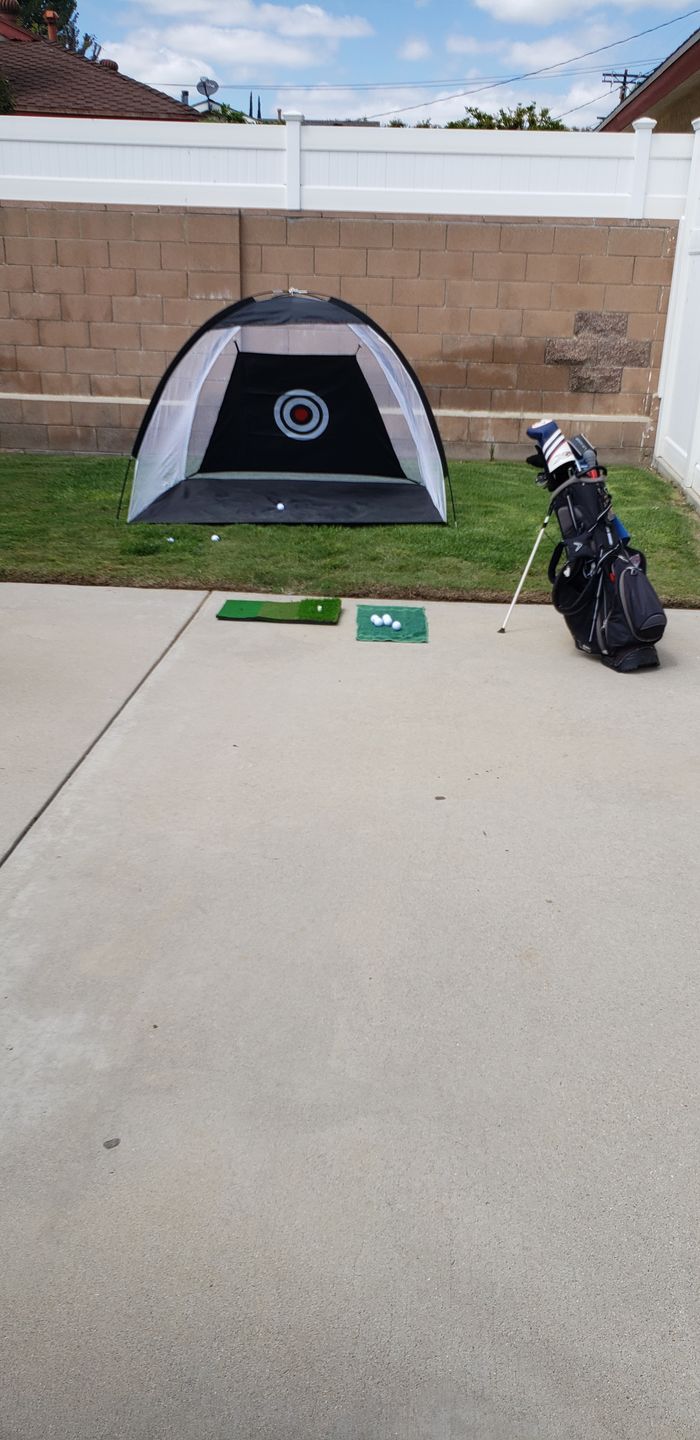 Customer photo review of Golf Practice Driving Net for Indoors and Outdoors | Tri-Turf Hitting Mat