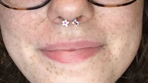 Customer photo review of Butterfly and Flower Horseshoe Ring