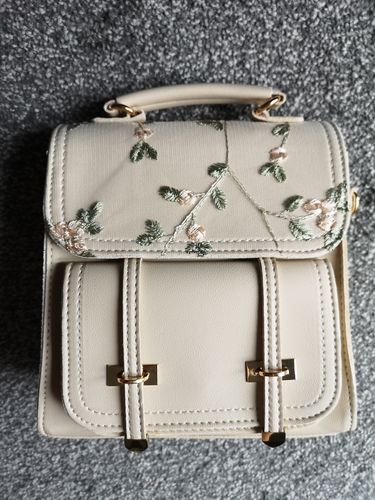 Customer photo review of Floral Embroidery Leather Backpack