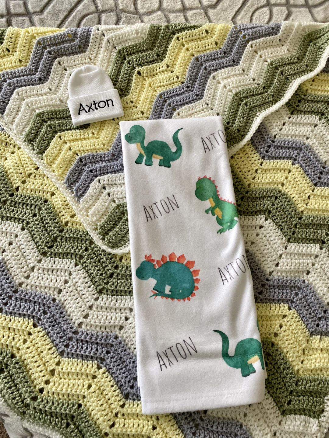 Customer photo review of Personalized Dinosaur Watercolor Print Baby Name Blanket