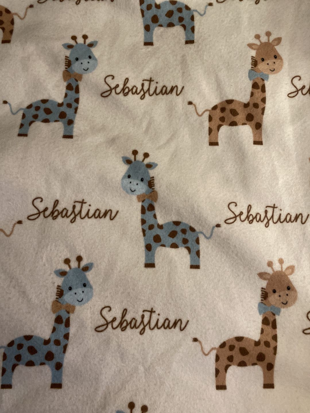 Customer photo review of Giraffe Fleece Personalized Baby Boy Blanket