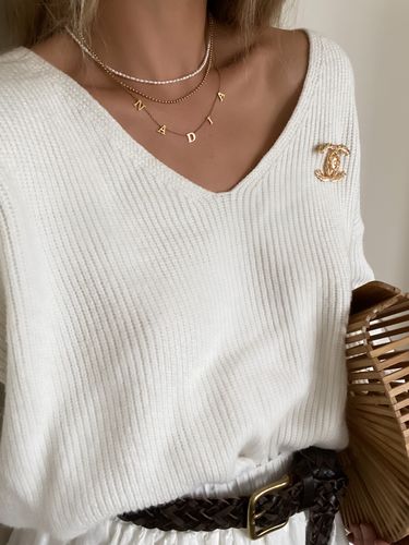 Customer photo review of The Tiny Spaced Name Necklace