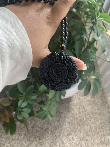 Customer photo review of Dragon Phoenix Yin Yang Obsidian Pendant Necklace