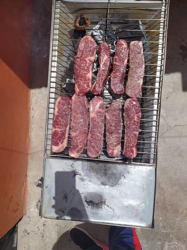 Reseña con foto de un cliente sobre Tablita de lomo