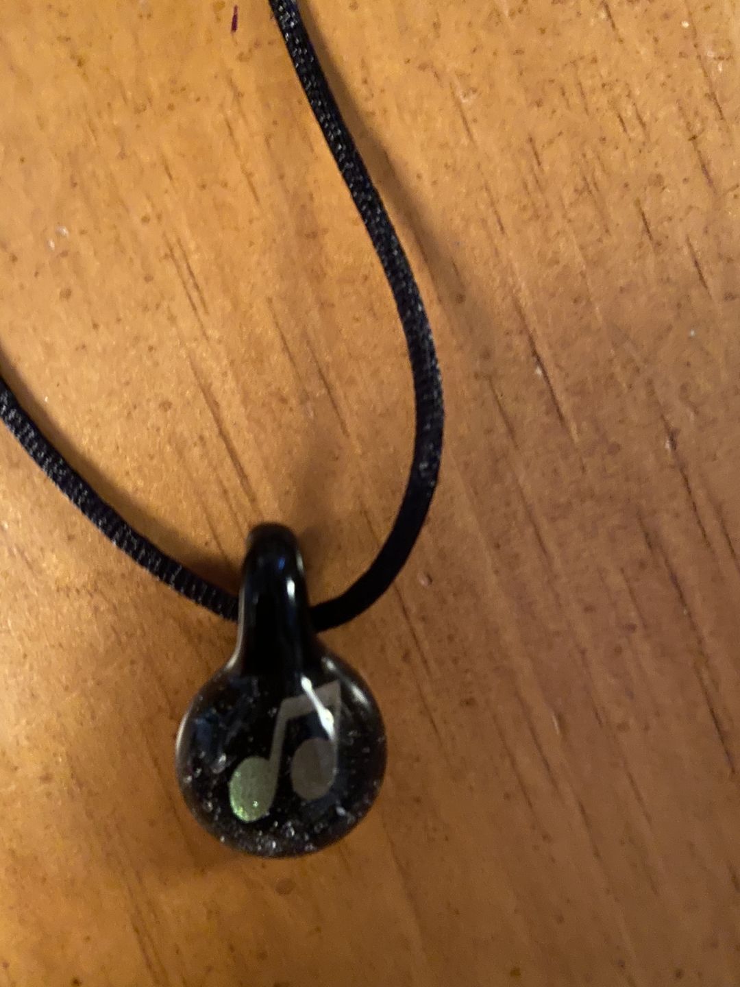 Customer photo review of Music Note Hologram Pendant with Infused Cremation Ash