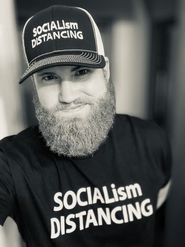 Customer photo review of Socialism Distancing Trucker Hat