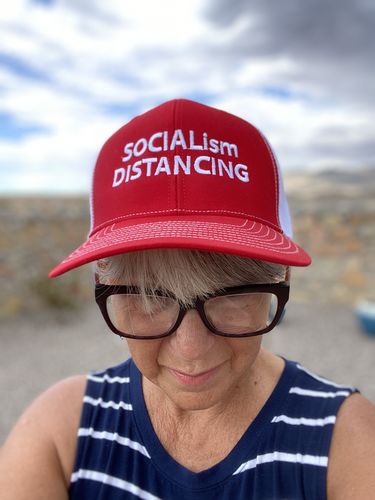 Customer photo review of Socialism Distancing Trucker Hat