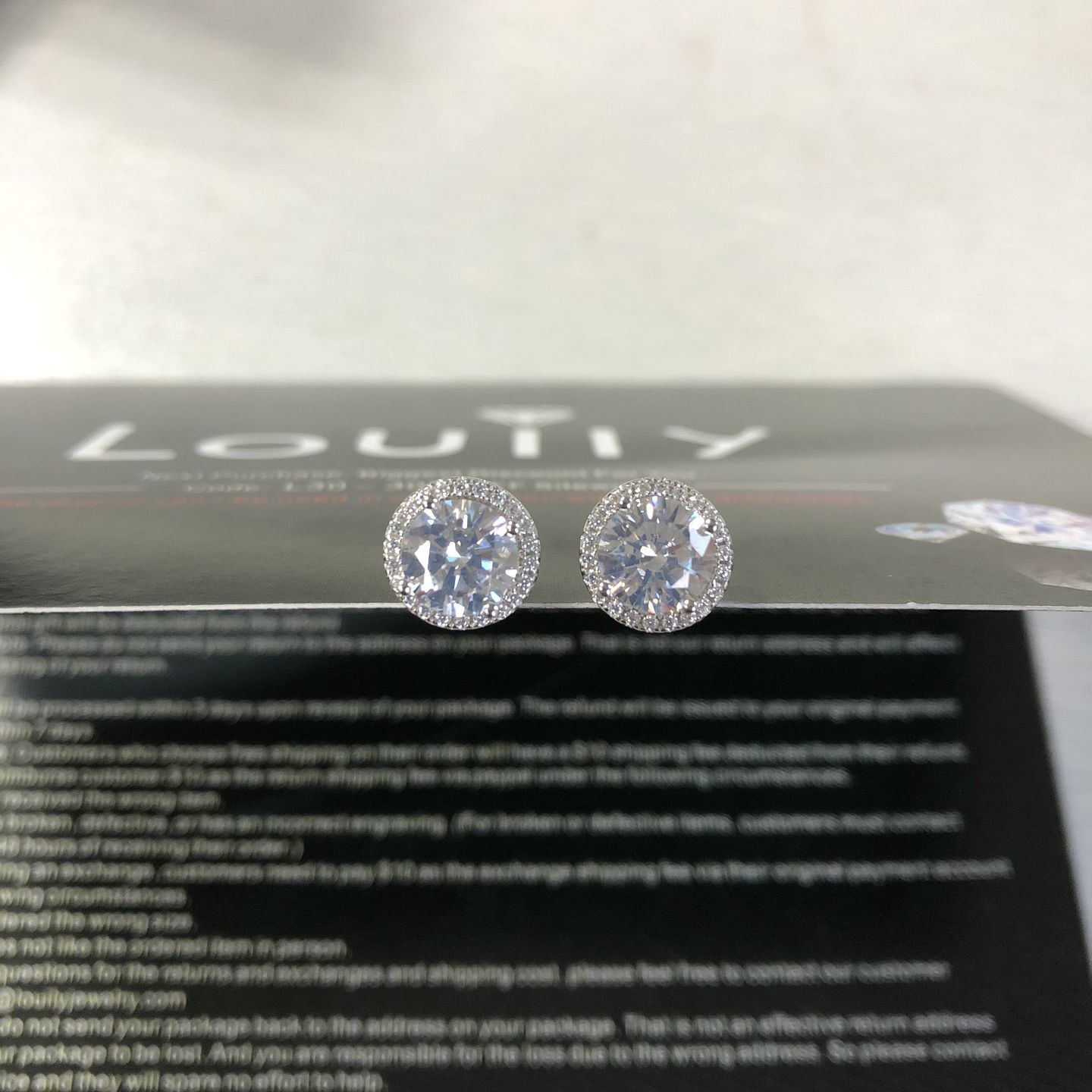 Customer photo review of Louily Sterling Silver Classic Halo Round Cut Earring