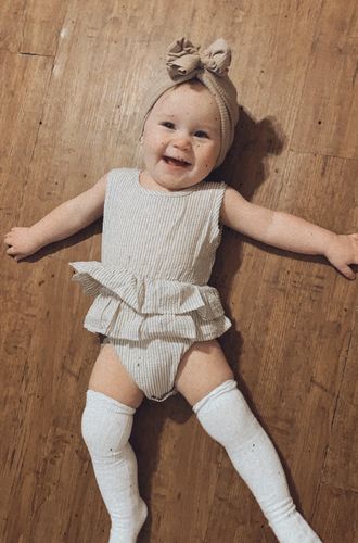 Customer photo review of Sasha romper in tan with white stripes