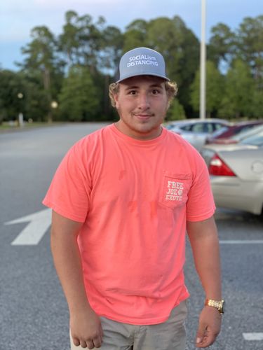 Customer photo review of Socialism Distancing Trucker Hat