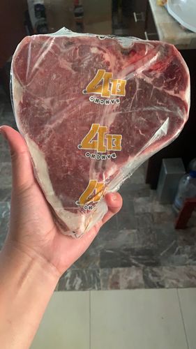 Reseña con foto de un cliente sobre Porterhouse Steak