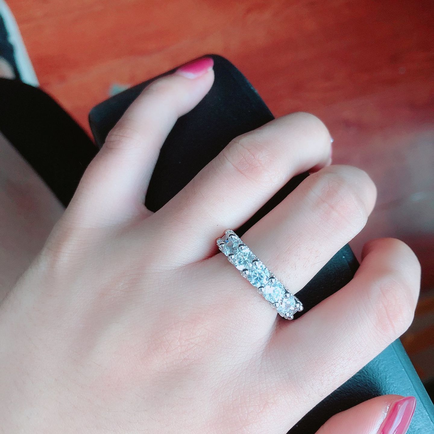 Customer photo review of Louily 5 Ct Luxury Eternity Round Cut Wedding Band In Sterling Silver