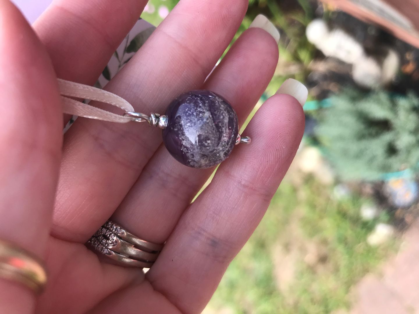 Customer photo review of Cosmic Swirl Memorial Pendant