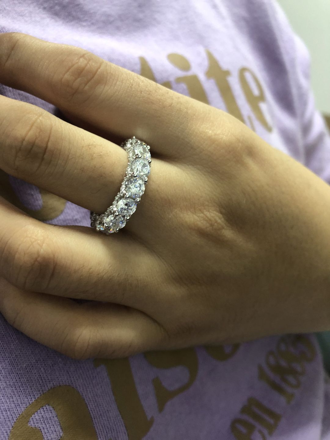 Customer photo review of Louily 5 Ct Luxury Eternity Round Cut Wedding Band In Sterling Silver