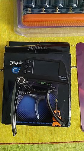 Customer photo review of TCapo20 Acoustic Guitar Tuner Capo Quick Change Key Capo Tuner Alloy Material for Electric Guitar Bass Chromatic Accessories