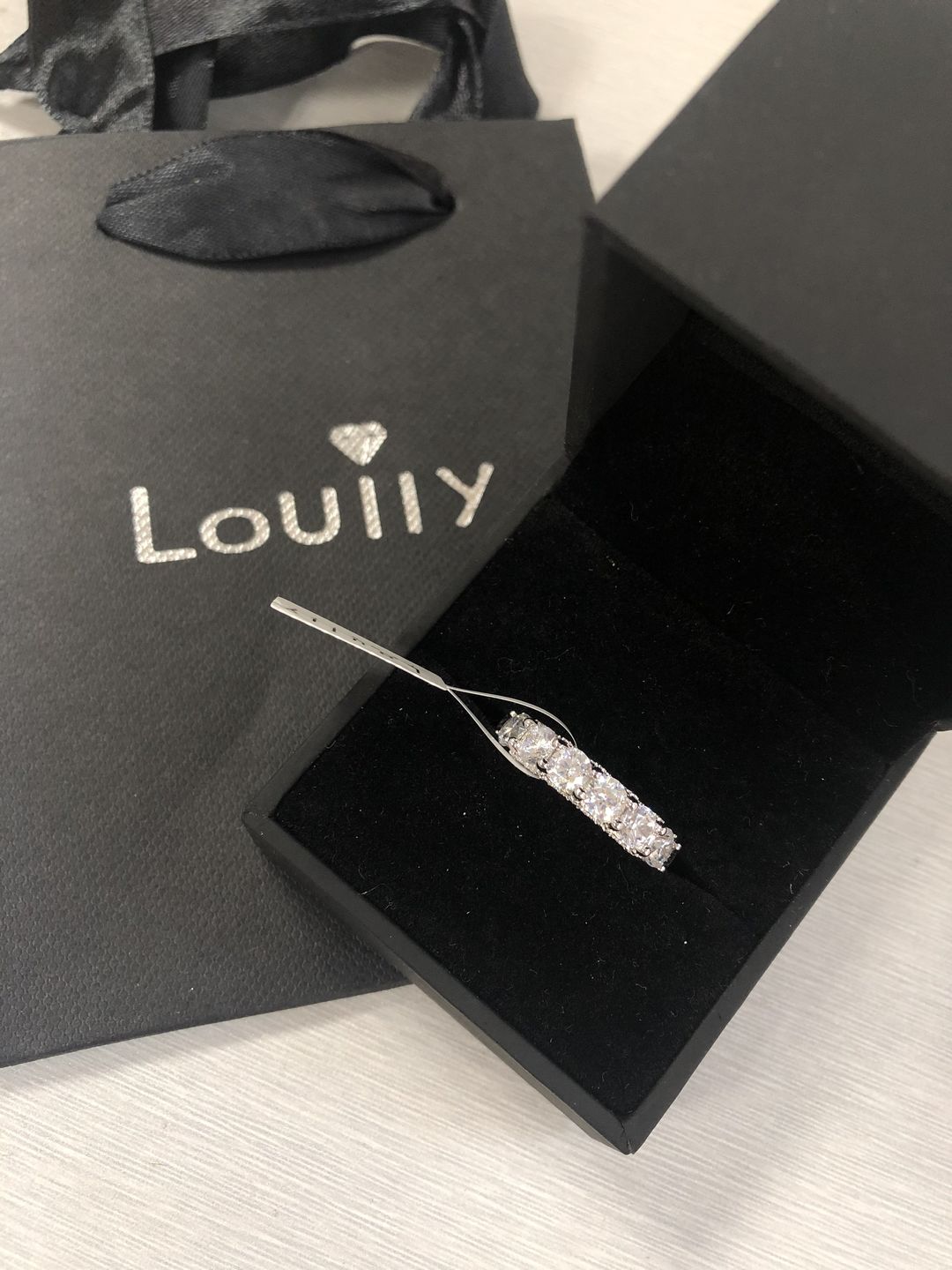 Customer photo review of Louily 5 Ct Luxury Eternity Round Cut Wedding Band In Sterling Silver