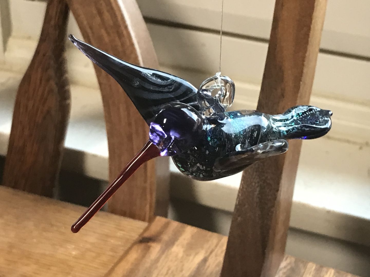 Customer photo review of Purple Dichroic Twist Glass Hummingbird with Infused Ash