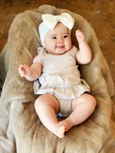 Customer photo review of Sasha romper in tan with white stripes