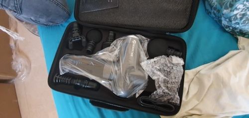 Customer photo review of BOOSTER Premium Massage Gun With 6 Massage Heads - Smart Hit Technology