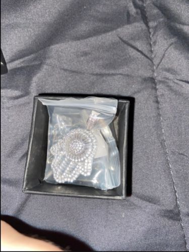 Customer photo review of White Gold Baguette Iced Out Hamsa Hand Pendant with  Franco/Rope Chain
