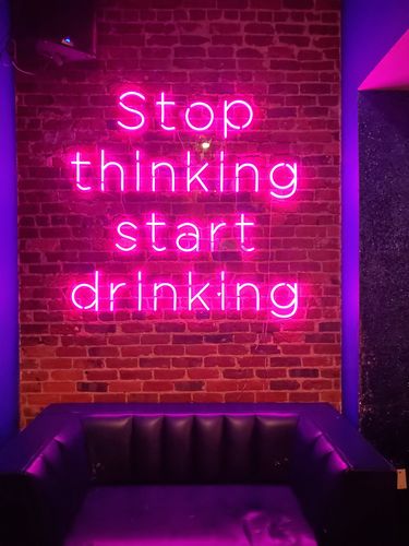 Customer photo review of 'Stop Thinking' Neon Sign