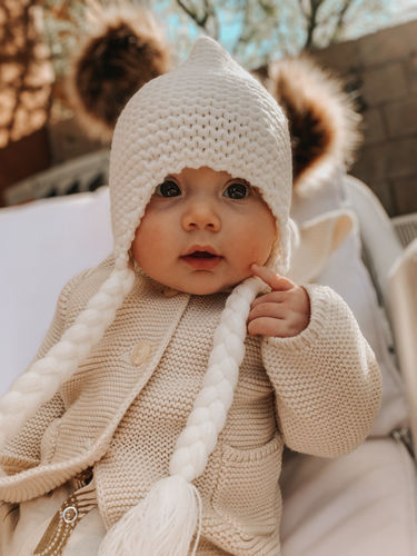 Customer photo review of Pom Pom Knit Braid Beanie in Ivory
