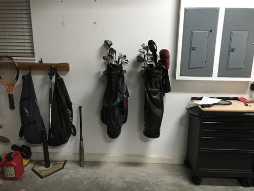 Customer photo review of Two Golf Bag Storage Rack