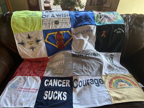 T-shirt quilt with volunteering, childhood cancer support themes by Cynthia from MO
