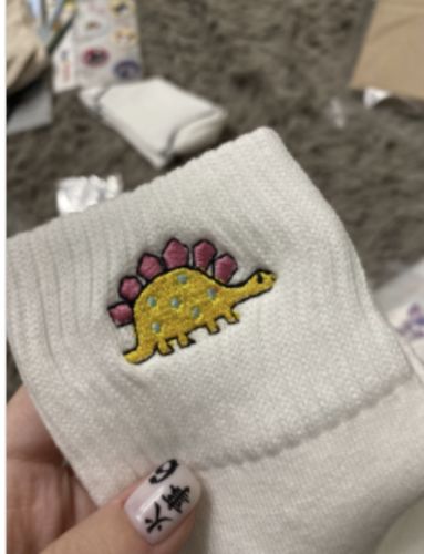 Customer photo review of Chaussette Dinosaure Stégosaure Blanc