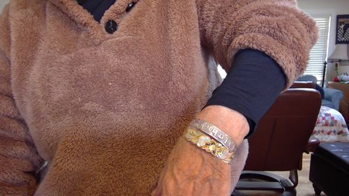 Customer photo review of Sterling Silver Two-Tone 14K Yellow Gold Plated Queen Scroll Cut Out Edge Bangle