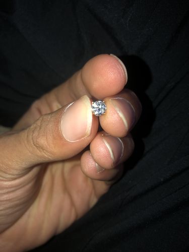 Customer photo review of VVS Moissanite Solitaire Stud Earrings