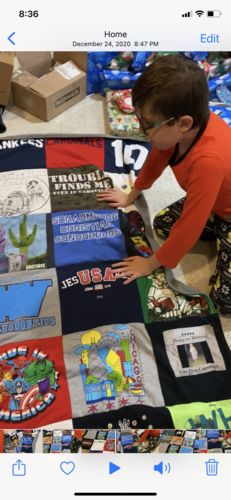 T-shirt quilt with superheroes, sports themes by Donna from IL
