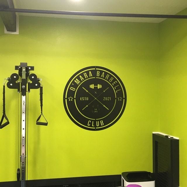 Customer photo review of Crossed Barbell Gym Sign