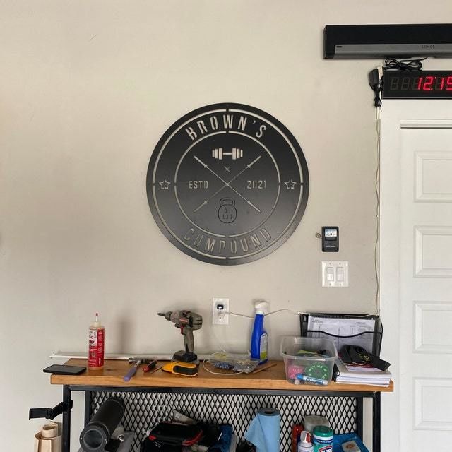 Customer photo review of Crossed Barbell Gym Sign