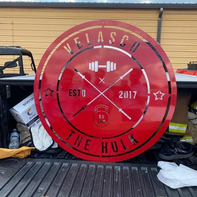 Customer photo review of Crossed Barbell Gym Sign