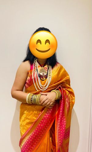 Customer photo review of festive orange and pink Woven banarasi Silk saree with brocade blouse
