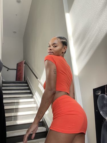 Customer photo review of Frame Baby Tee in Orange