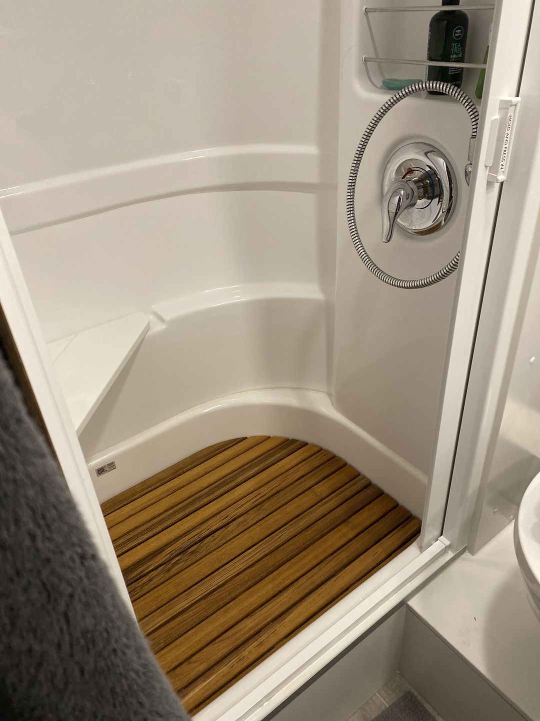 Customer photo review of Corner Bath Airstream Teak Shower Mat (2021 and later)