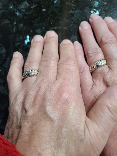 Customer photo review of Black Hills White Gold His & Hers Diamond Foliage Wedding Ring Set II