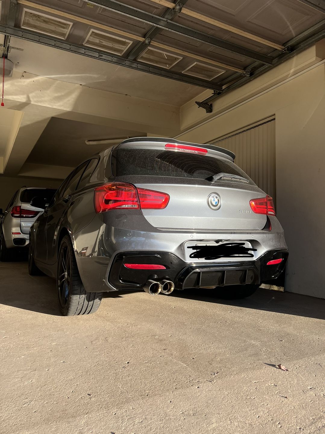 Customer photo review of ABS Glossy Black Rear Bumper Diffuser for BMW 1 Series【F20 M140/M135 & 125/120/118 M Sport】【2015-2019】LCI/LCI-2【left】