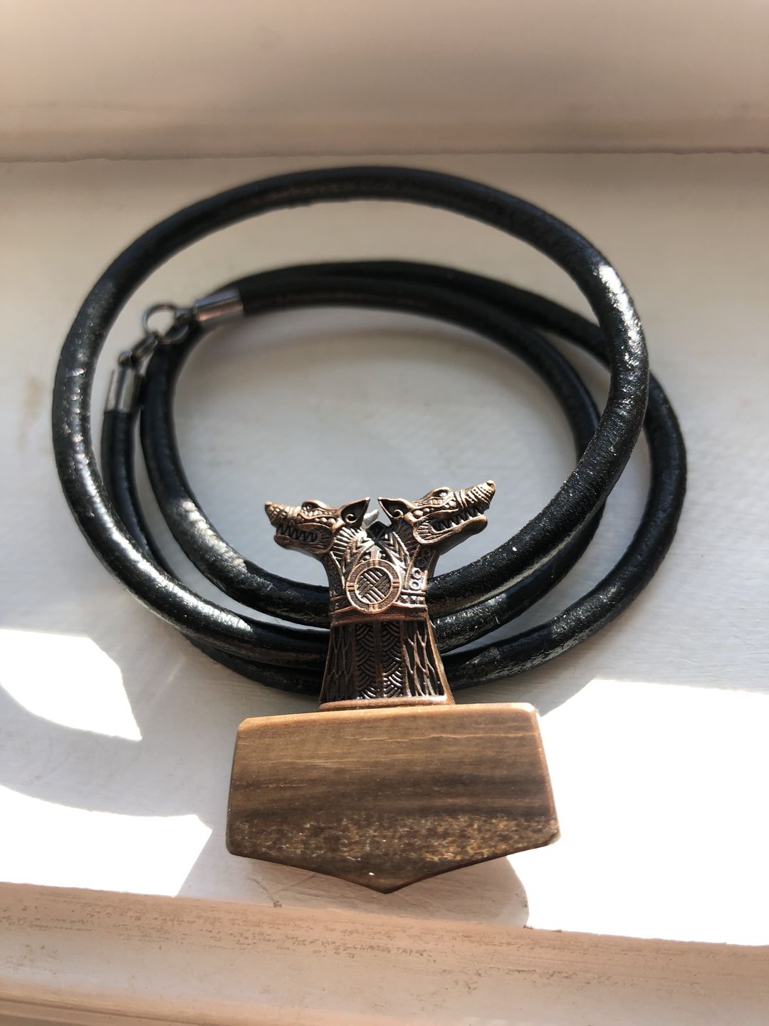 Customer photo review of Wolf Mjolnir with Petrified Wood