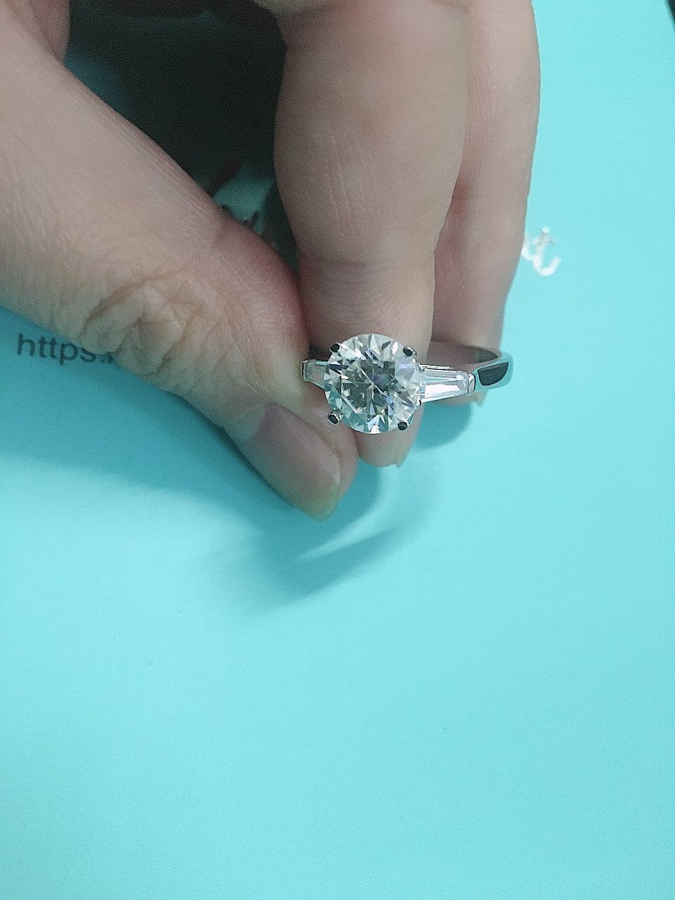 Customer photo review of Three Stone Round Moissanite Tapered Baguette Engagement Ring